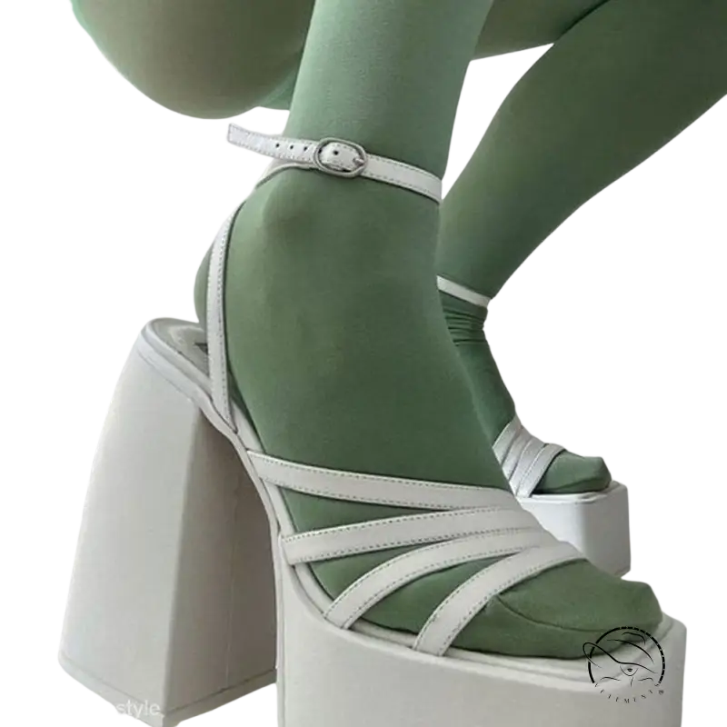 White ankle strap heel with strappy design and mint green socks