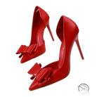 Elegant sweet high-heeled pumps in red patent leather with bow toe