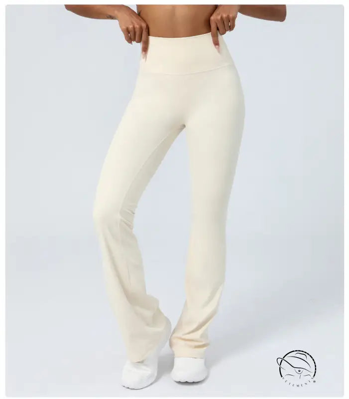Purplish blue flared yoga pants with cream-colored accents
