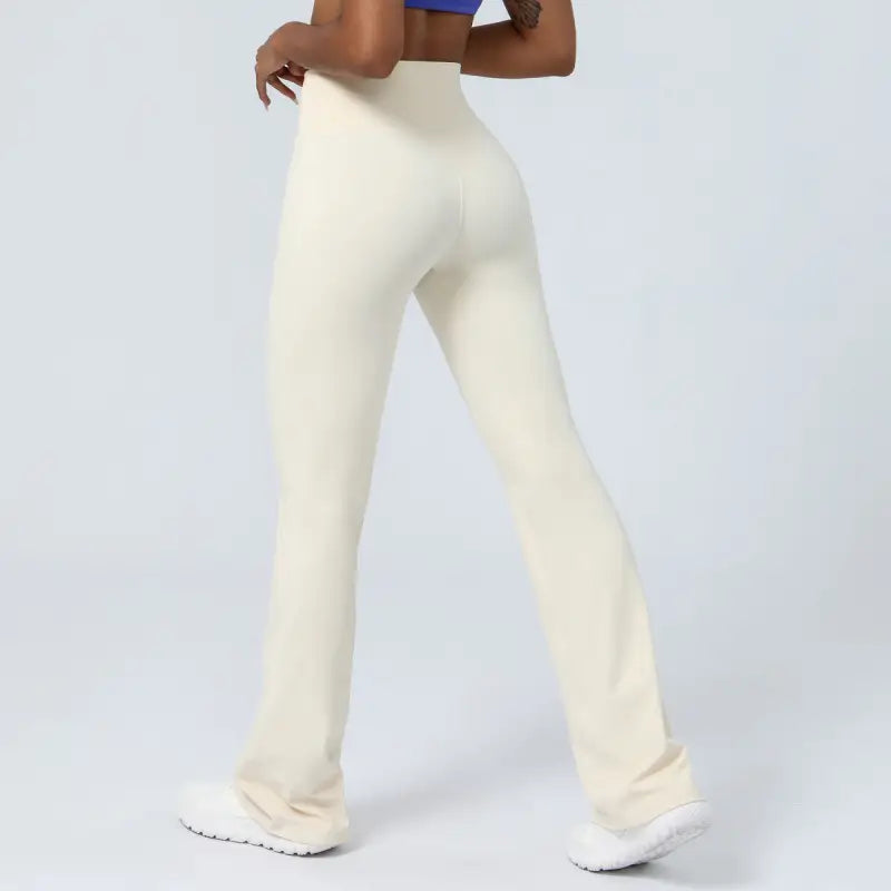 Cream-colored high-waisted flared yoga pants perfect for casual flared yoga pants style