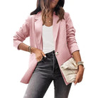 Woman wearing a purplish blue slim fit jacket outfit suitable for office settings