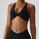 Black twisted-front sports bra in dark reddish purple and tropical orange for quick drying yoga
