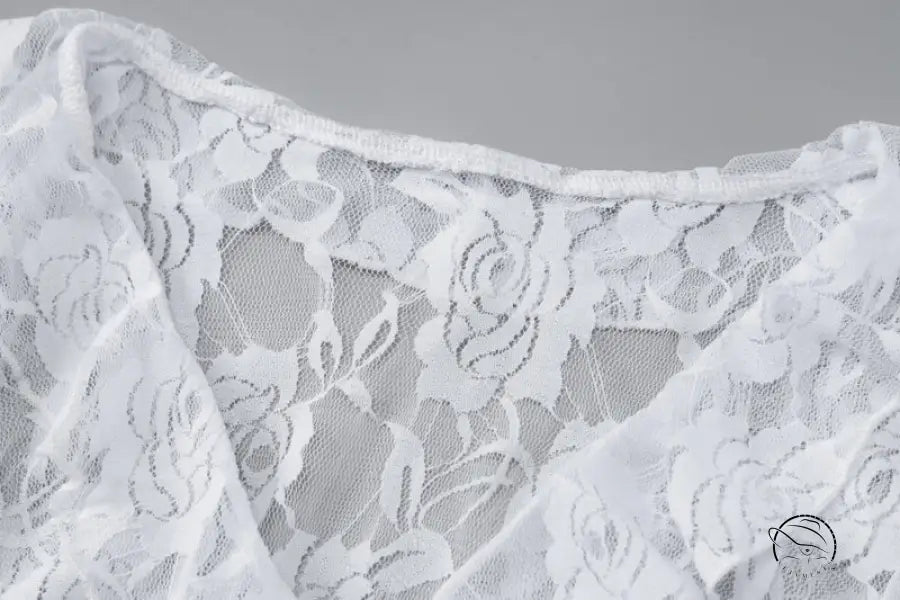 Delicate white lace sheath dress with floral pattern and ruffles by Langry