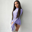 Woman in a sexy sheath long sleeve bodycon dress with matching gloves in lavender