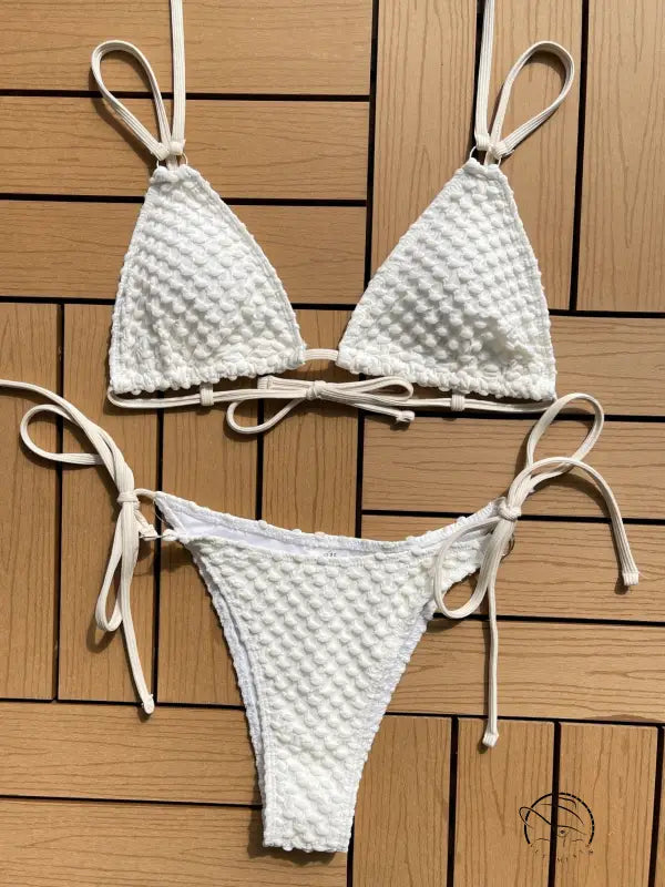 White textured bikini with triangle top and tie-side bottom.