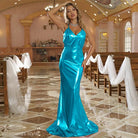 Satin turquoise evening gown of a slim fit cotton padded trailing evening dress