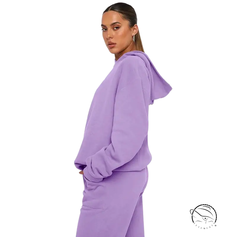 Woman in lavender hooded long sleeve sweater with soft touch trousers