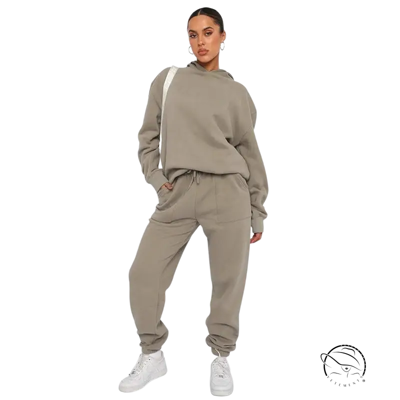 Woman in soft touch trousers and warm comfortable long sleeve sweater with white sneakers