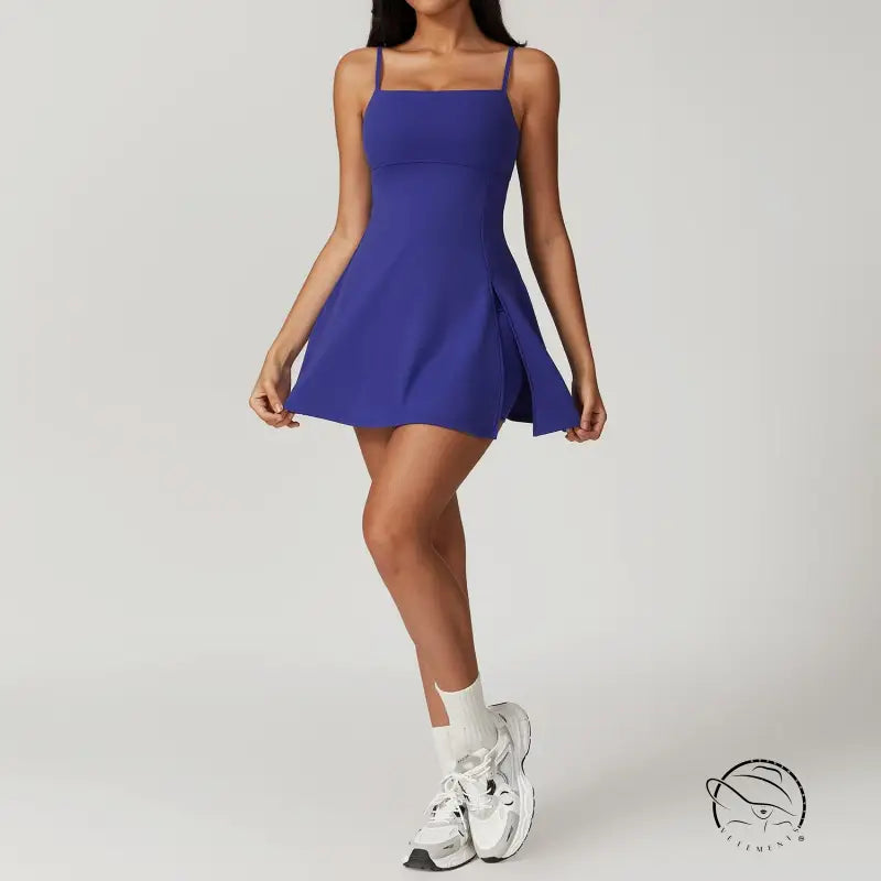 Royal blue skater dress in colored glaze blue with white socks and chunky sneakers