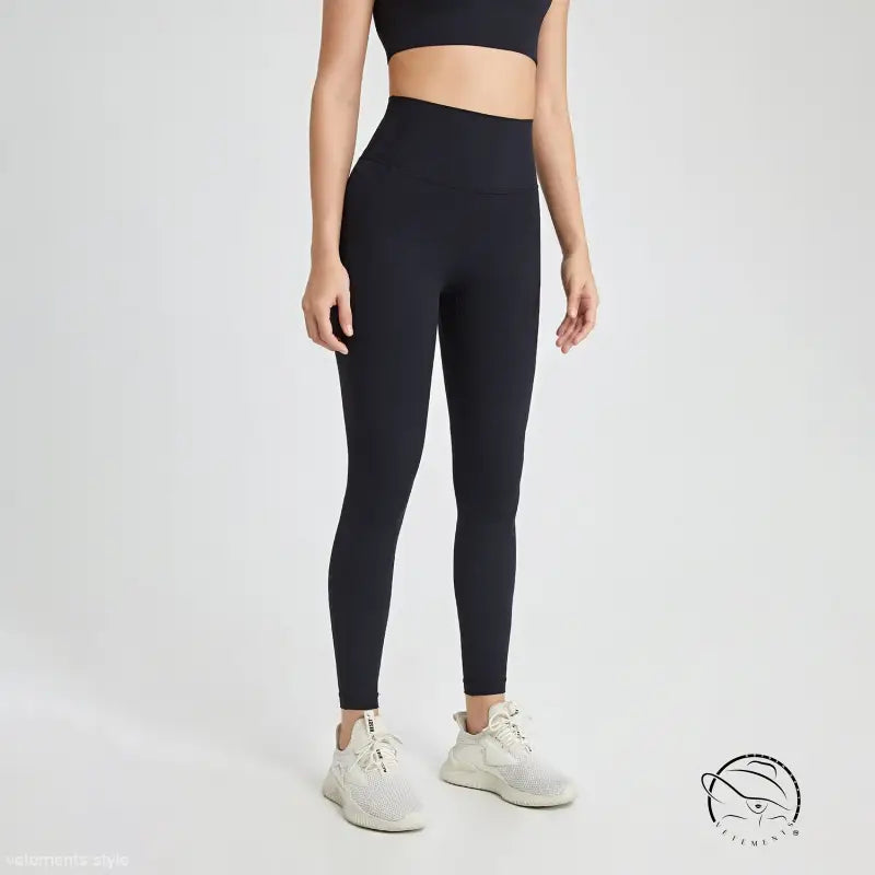 Wild berry high-rise nylon pants with black leggings and white sneakers