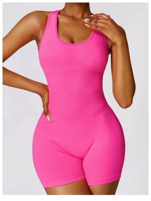Form-fitting pink romper featured with Sporty High Rise Nylon Shorts in Volcanic Ash