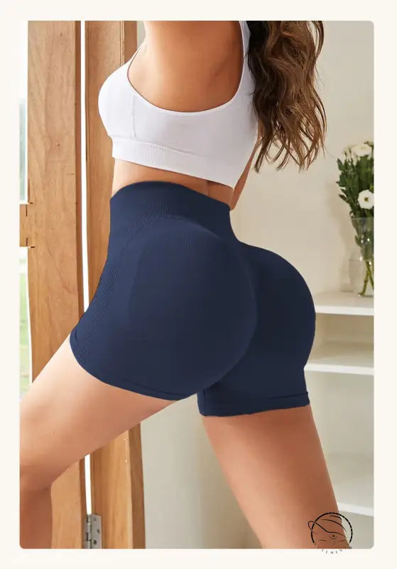 Navy blue quick drying tight fitness pants on lower body