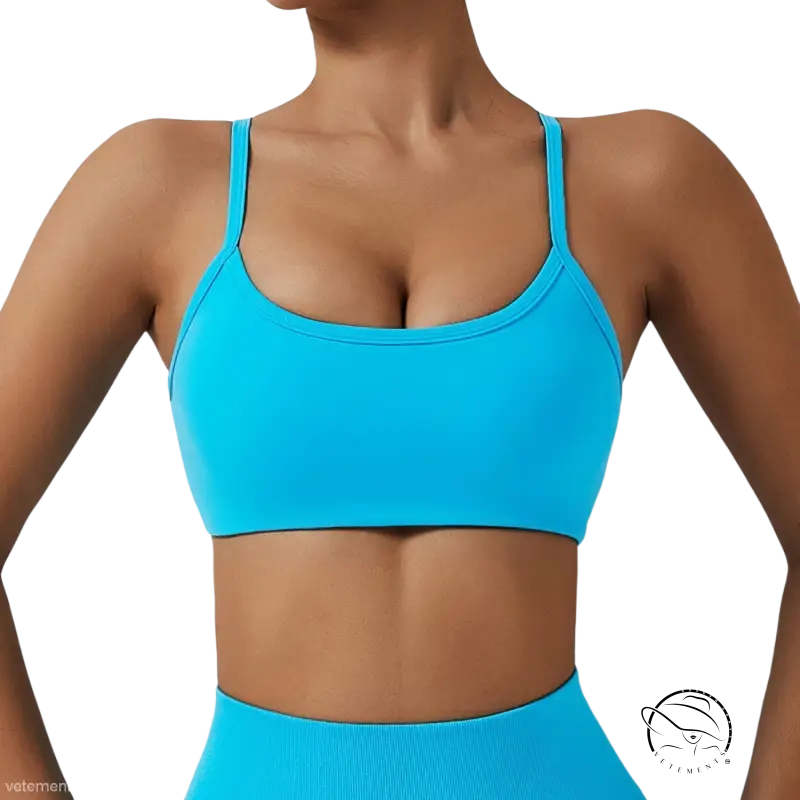 Bright turquoise sports bra with fluorescent orange cutout back straps