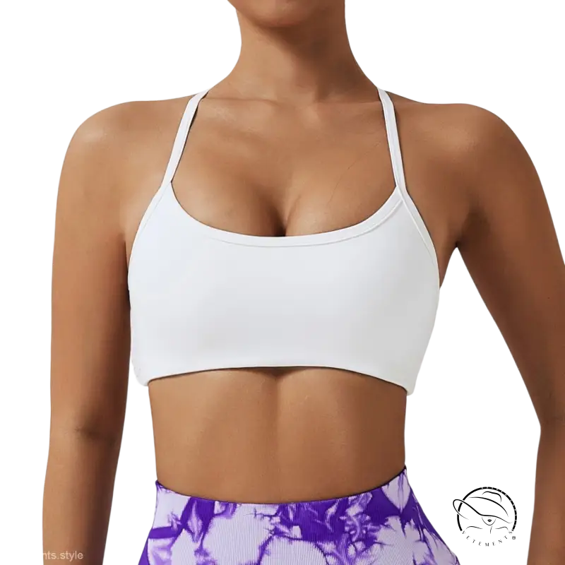White sports bra in advanced black and fluorescent orange with cutout back straps