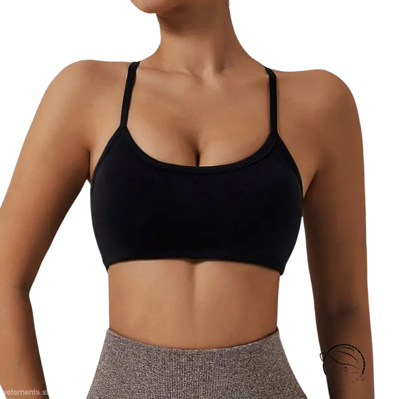 Black sports bra with thin straps, scoop neckline in advanced black and fluorescent orange