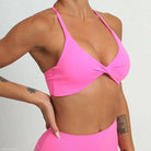 Pink twisted-front sports bra from Sporty Nylon Yoga Bra Activewear in Chishi Orange & Klein Blue