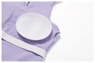 White circular nursing pad on light purple fabric with Sporty Slim Nylon High Rise Bottom in Swan White Suit