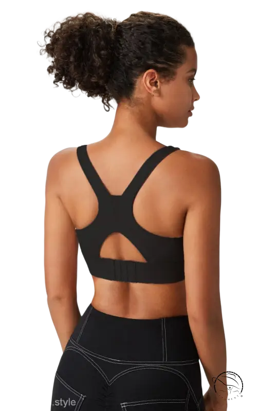 Black racerback sports bra integrated with mold cup and cutout back