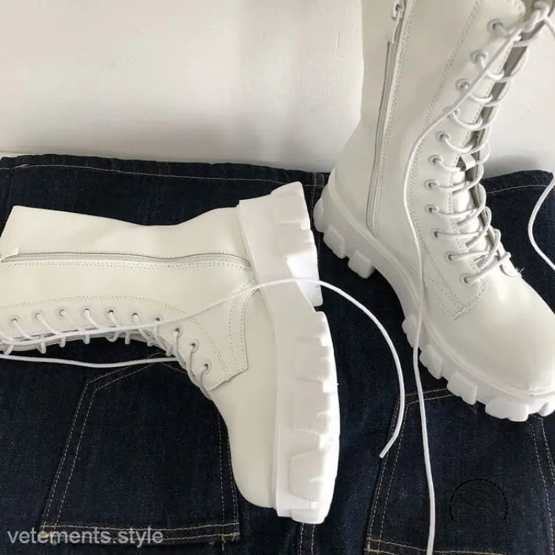 Stylish lace-up platform boots in white with chunky soles