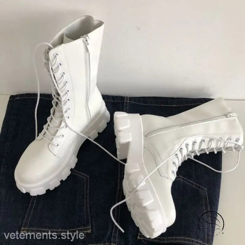 Stylish lace-up platform boots in white with chunky soles and side zippers