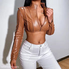 Brown faux leather crop top displayed with a stylish short leather coat for spring wear