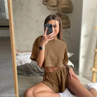 Brown ribbed lounge set featuring a unique loose top with split crew neck and short sleeves