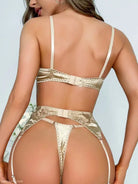 Gold satin lingerie set featuring floral embroidery with bra, thong, and garter straps
